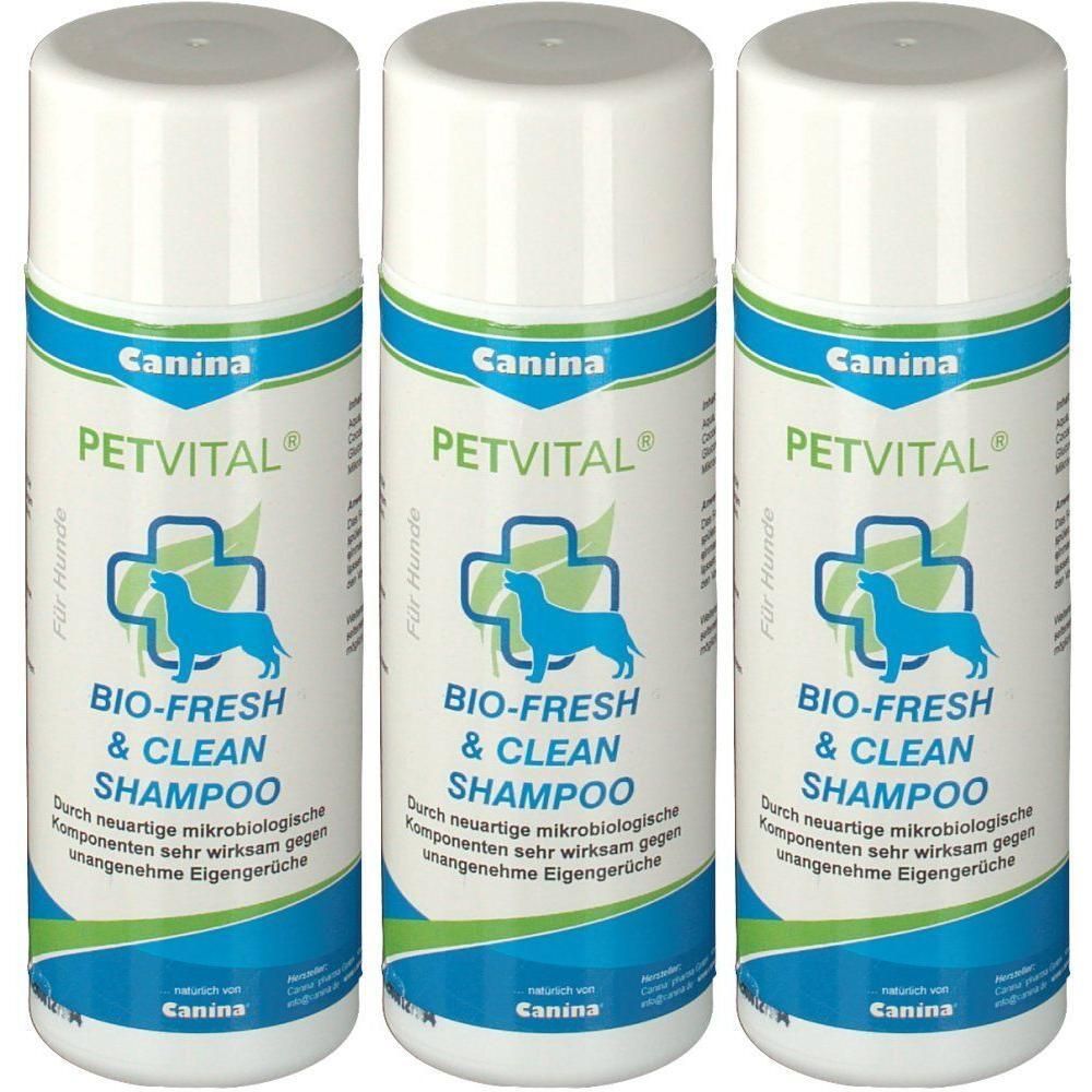 Drei Flaschen Canina PETVITAL BIO-FRESH & CLEAN SHAMPOO für Hunde mit Hundesymbol und Kreuz.
