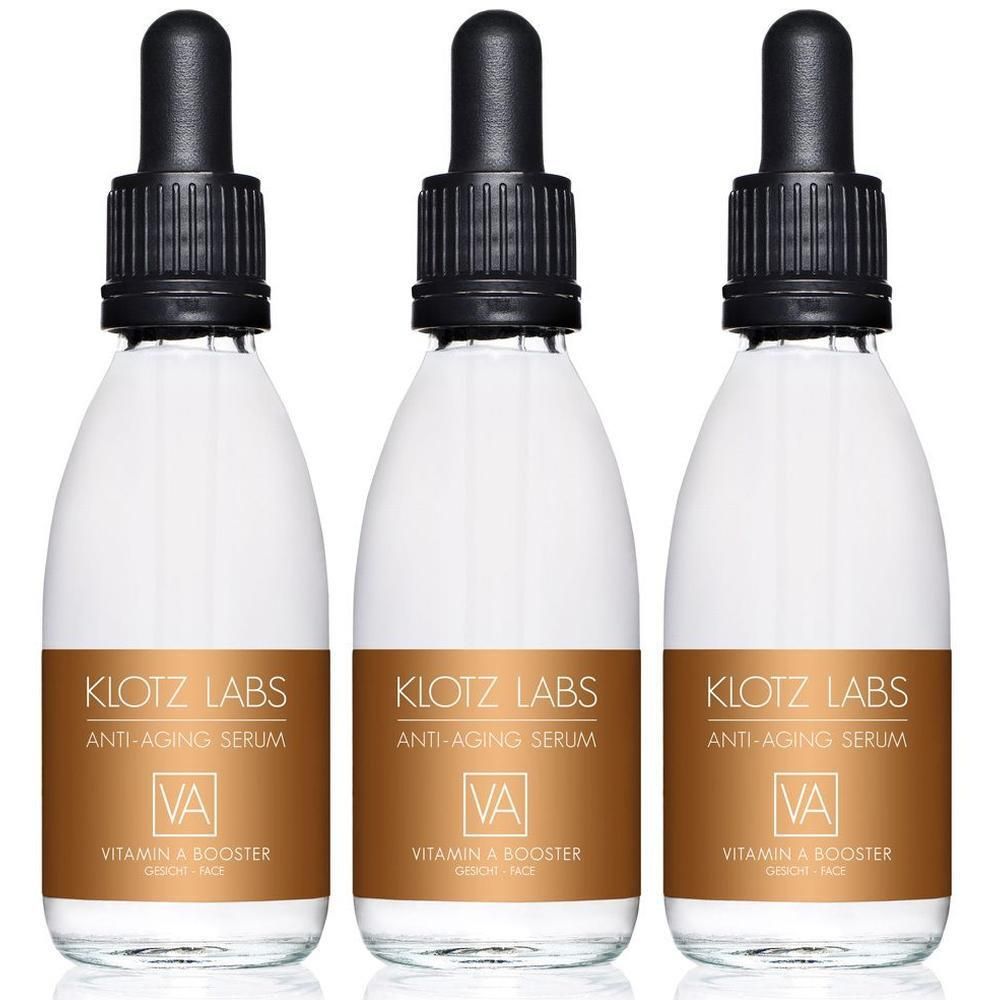 Drei Flaschen Klotz Labs Vitamin A Booster Anti-Aging Serum mit Pipetten.