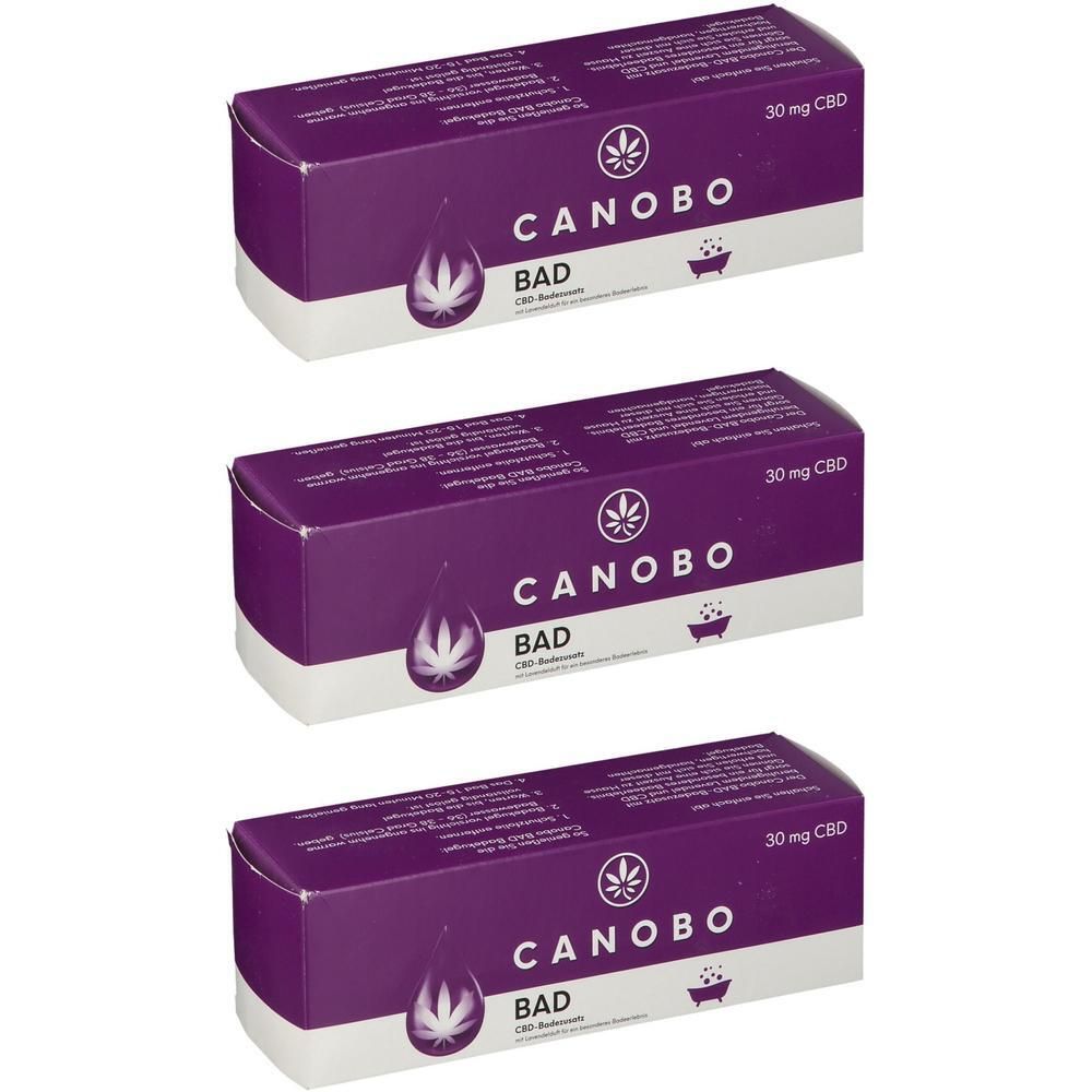 Drei lila Kartons mit "CANOBO BAD" und "30 mg CBD" Aufschrift.