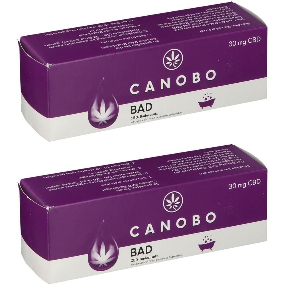 Zwei Packungen CANOBO BAD mit je 30 mg CBD. Lila Karton mit weißem Aufdruck.