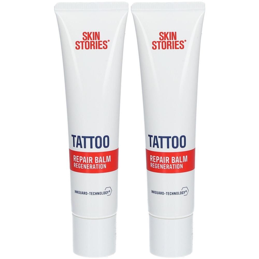 Zwei weiße Tuben mit SKIN STORIES TATTOO REPAIR BALM REGENERATION.