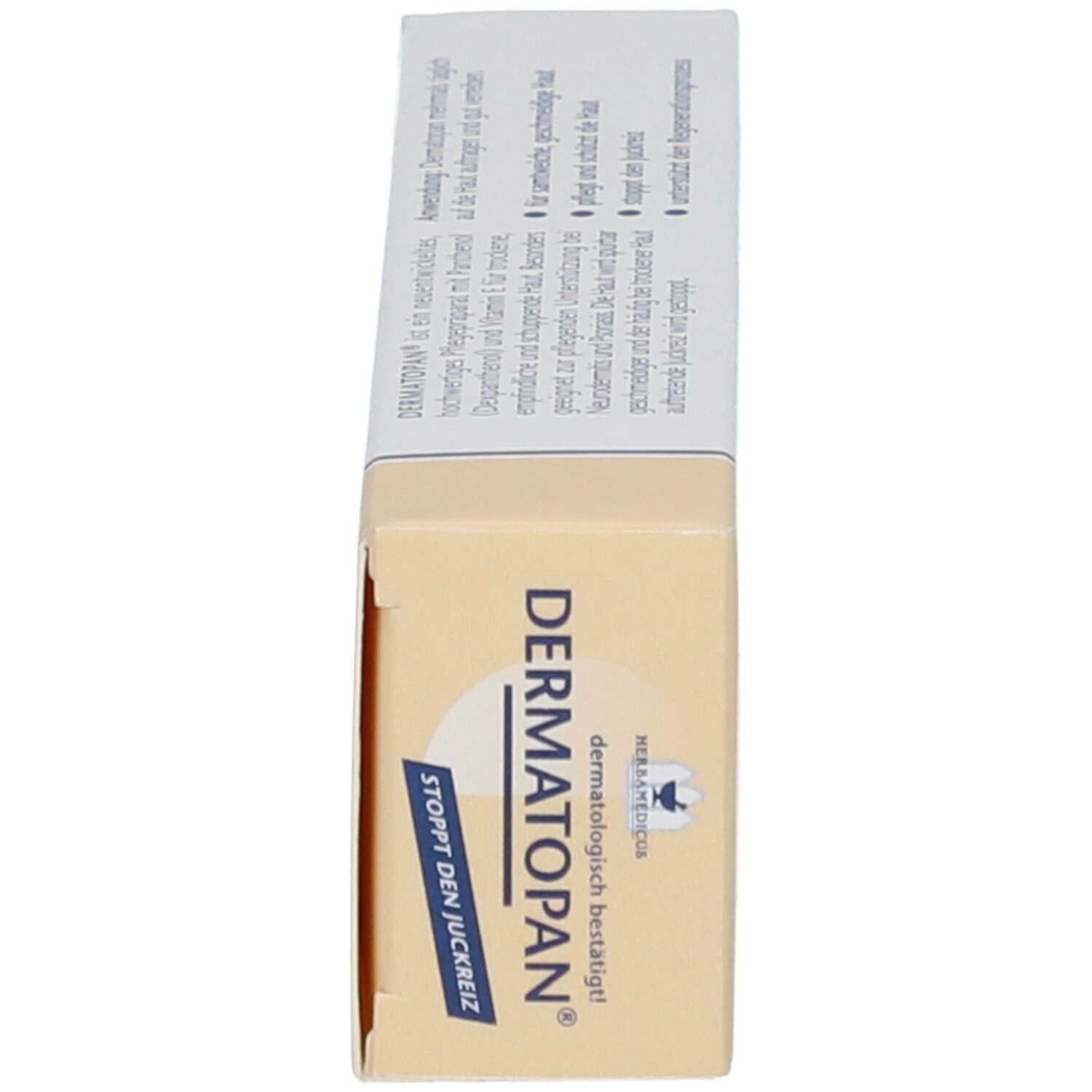 Produktverpackung. Weiß und beige. Aufschrift: Dermatopan®. Enthält Informationen zur Pflege trockener und schuppiger Haut.