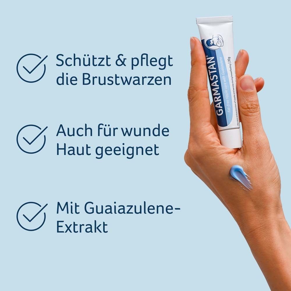 Hand mit Garmastan® Salbe. Schützt & pflegt Brustwarzen. Auch für wunde Haut geeignet. Mit Guajazulen-Extrakt.