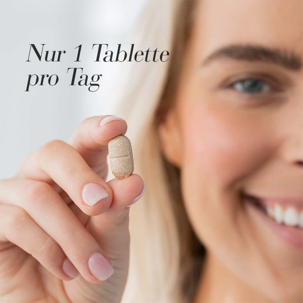 Frau hält eine Tablette. Text: Nur 1 Tablette pro Tag.