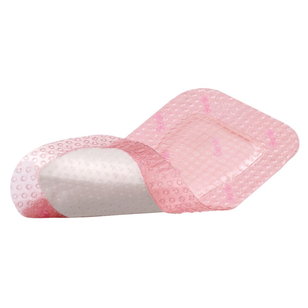 Eine rosa Schaumstoffkompresse mit Silikonrand, die auf einer Seite liegt.