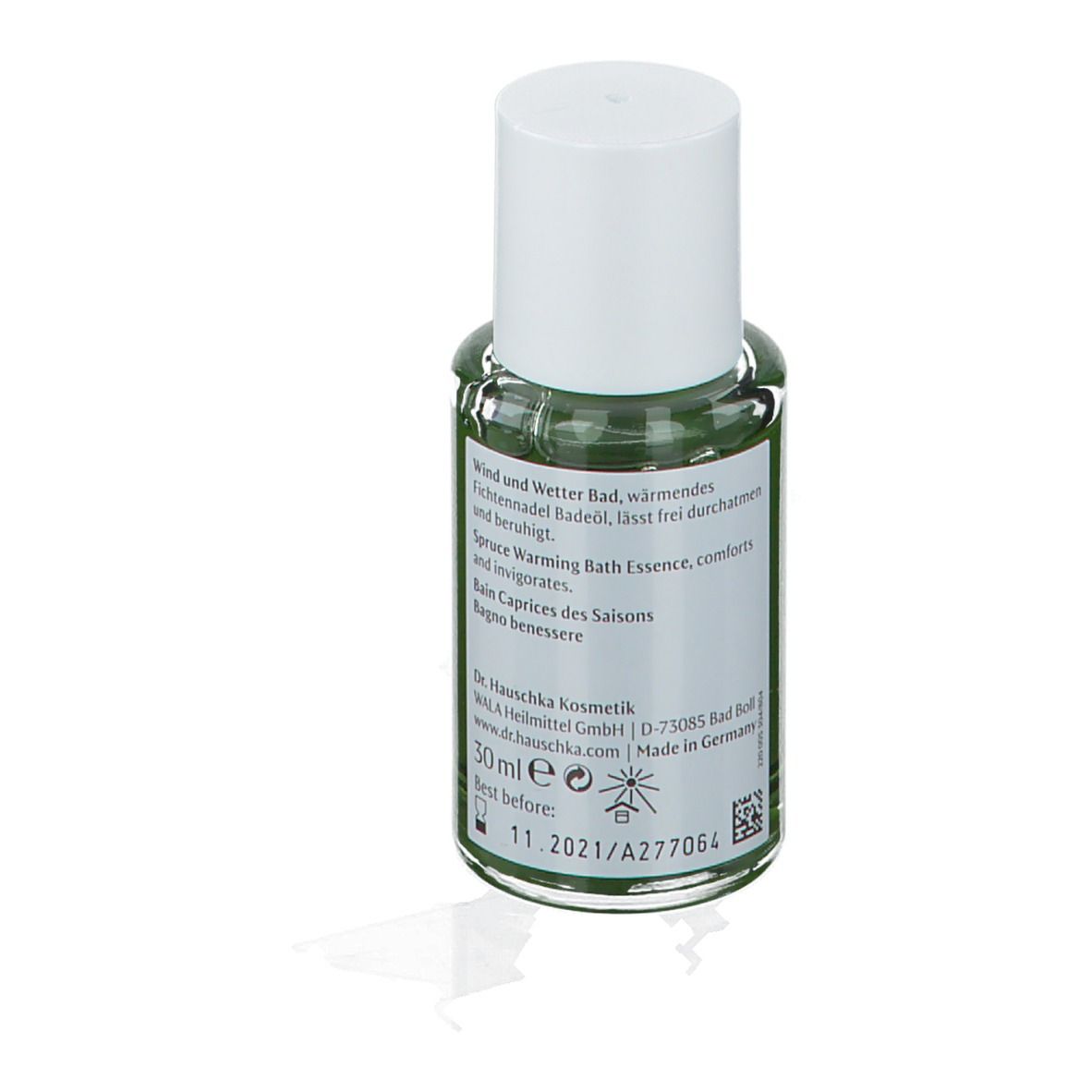 Rückansicht der Glasflasche. Etikett mit Text, grüner Flüssigkeit und Haltbarkeitsdatum.