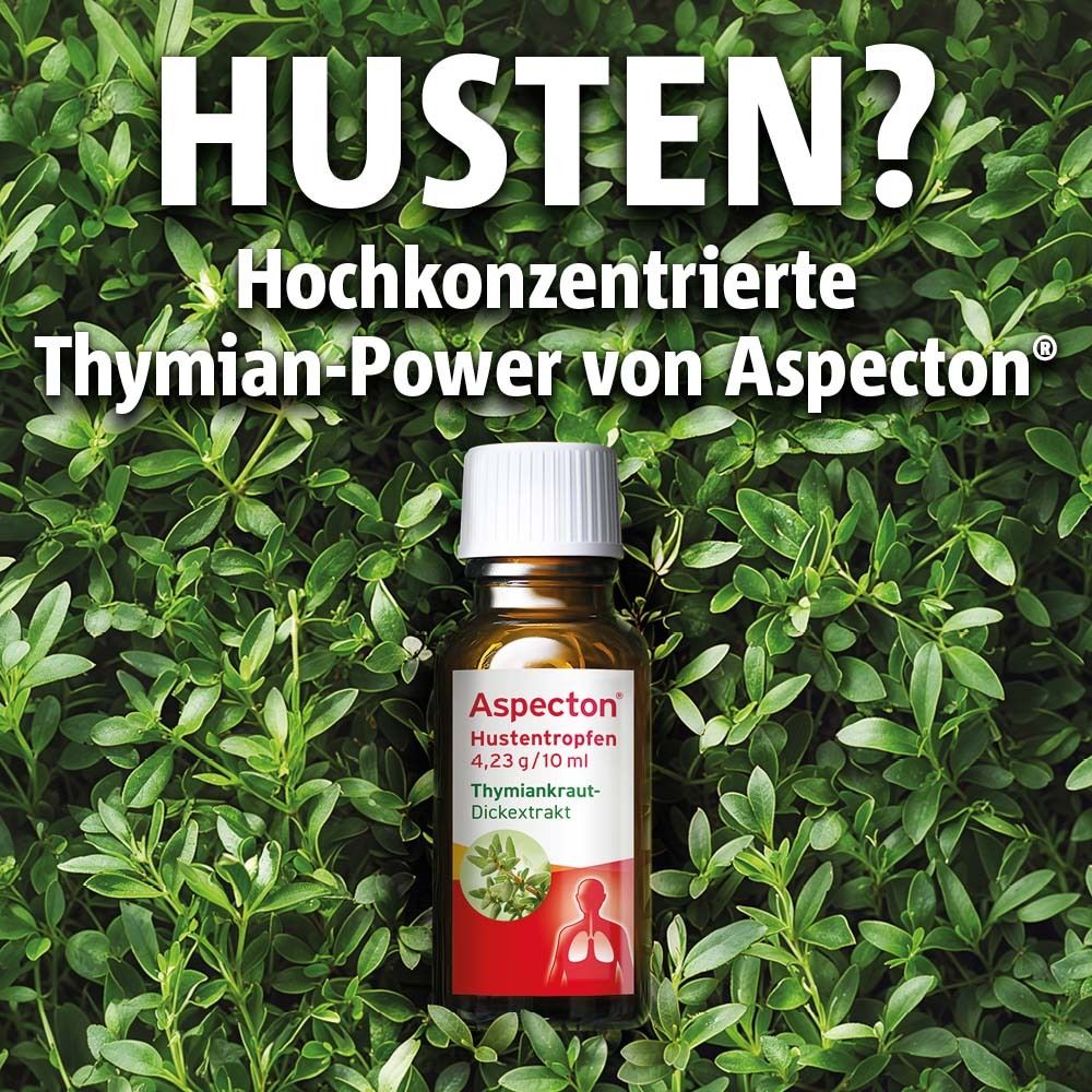 Braune Flasche mit weißem Deckel, umgeben von grünen Blättern. Aufdruck mit Produktinformationen.