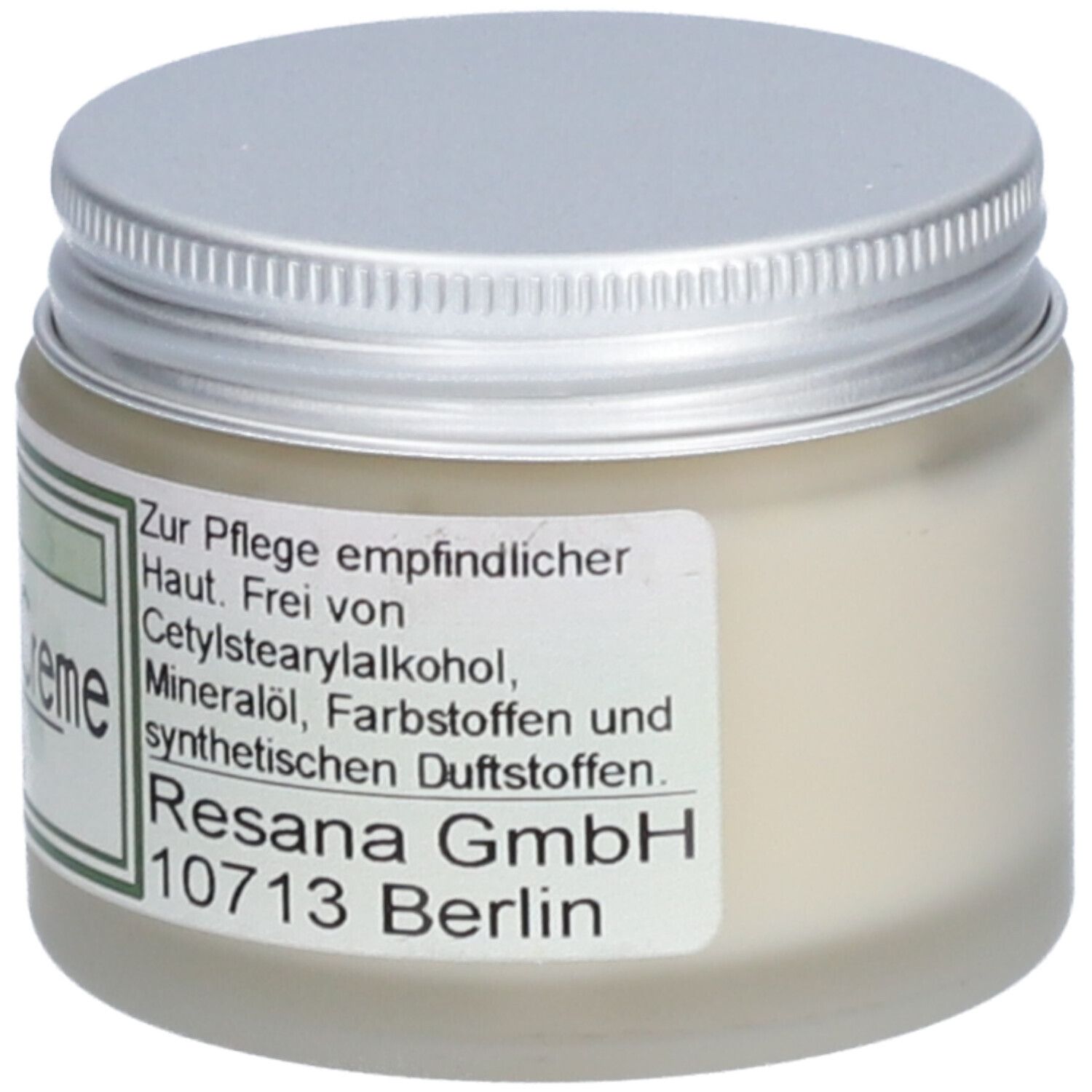 Creme-Glas mit silbernem Deckel. Auf dem Etikett stehen Informationen zur Pflege empfindlicher Haut.