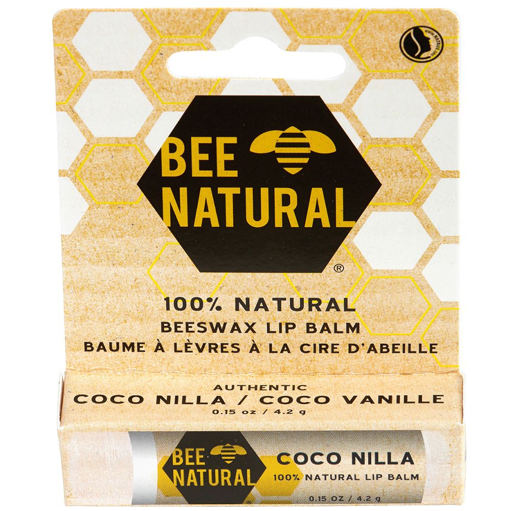 Lippenbalsam in Verpackung. "BEE NATURAL"-Logo. Text: "100% NATURAL", "BEESWAX LIP BALM", "COCO NILLA".