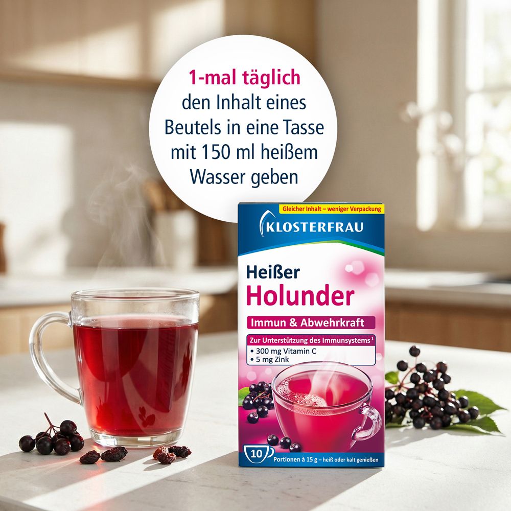 Glasbecher mit rotem Getränk, daneben Karton KLOSTERFRAU Heißer Holunder. Text: 1-mal täglich Inhalt in Tasse mit 150 ml heißem Wasser.