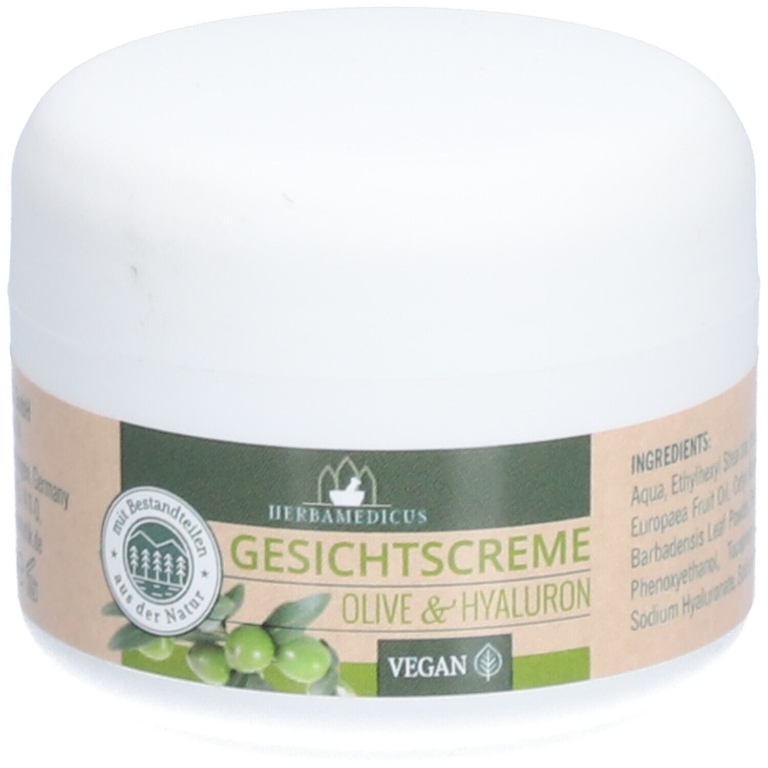 Weiße Creme-Dose mit Etikett. Aufschrift: Herbamedicus Gesichtscreme Olive & Hyaluron. Vegan-Siegel. Grün-braunes Etikett.
