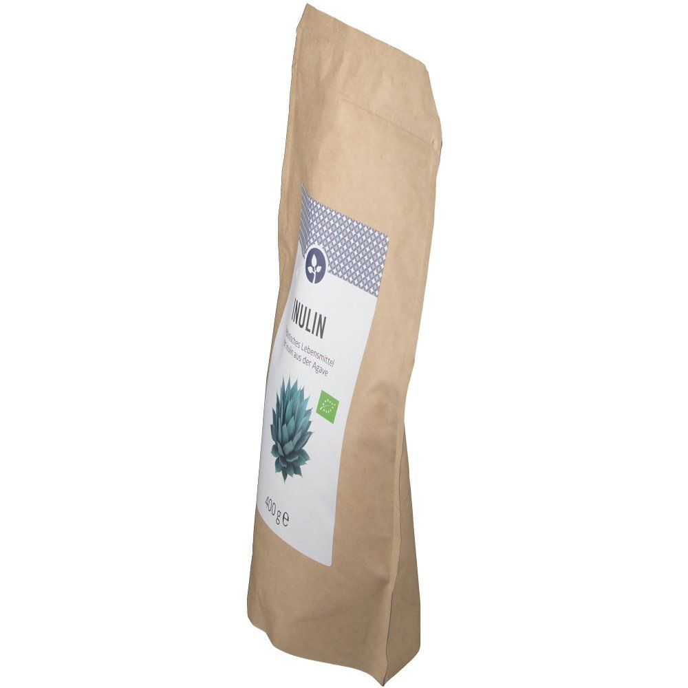 Brauner Papierbeutel, Seitenansicht. Weißes Etikett mit Aufschrift INULIN, Agaven-Abbildung, Bio-Siegel. Beutel ist leicht schräg.