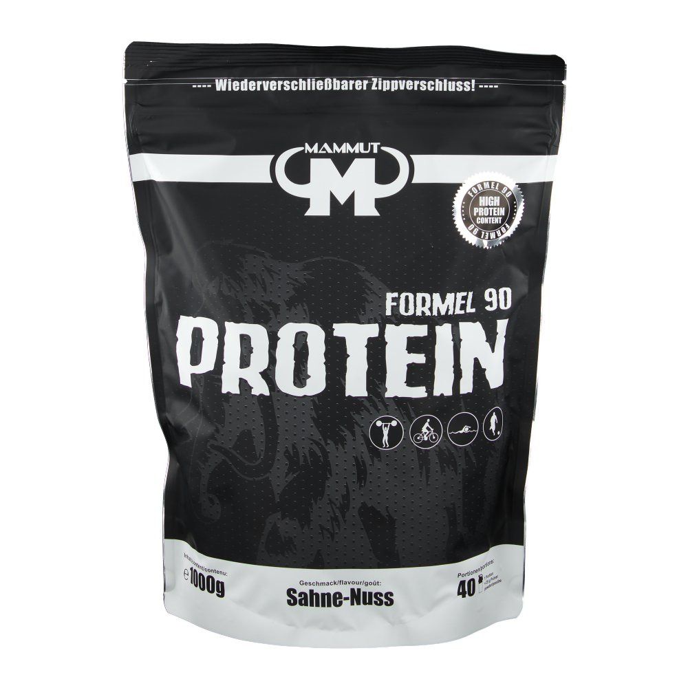 Schwarze Verpackung mit weißer Schrift. Enthält "Mammut Formel 90 Protein". Aufschrift "Sahne-Nuss". Siegel "High Protein Content".