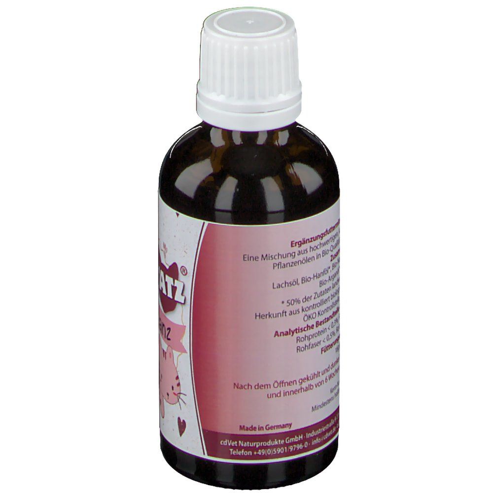 Rückseite der Flasche. Rosa Etikett mit Text. Enthält Informationen über Inhaltsstoffe und Hersteller.