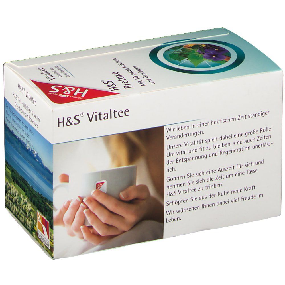 H&S Vitaltee-Verpackung. Weißer Karton mit Produktnamen, Logo und Händen, die eine Tasse halten.