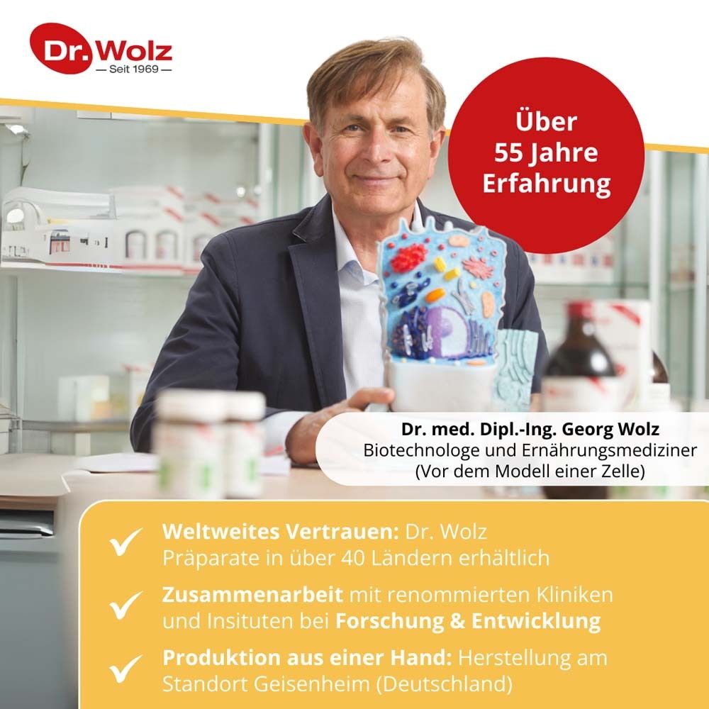 Mann im Labor. Text: Über 55 Jahre Erfahrung. Dr. med. Georg Wolz. Weltweites Vertrauen. Produktion aus einer Hand.