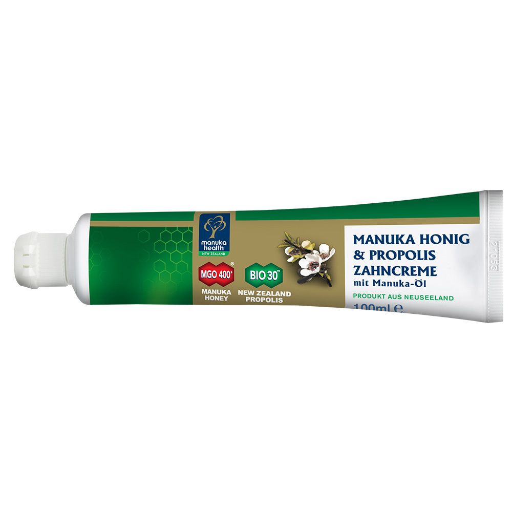 Zahnpasta-Tube. Grün, weiß und goldfarben. Text: MANUKA HONIG & PROPOLIS ZAHNCREME. Marke: MANUKA HEALTH.