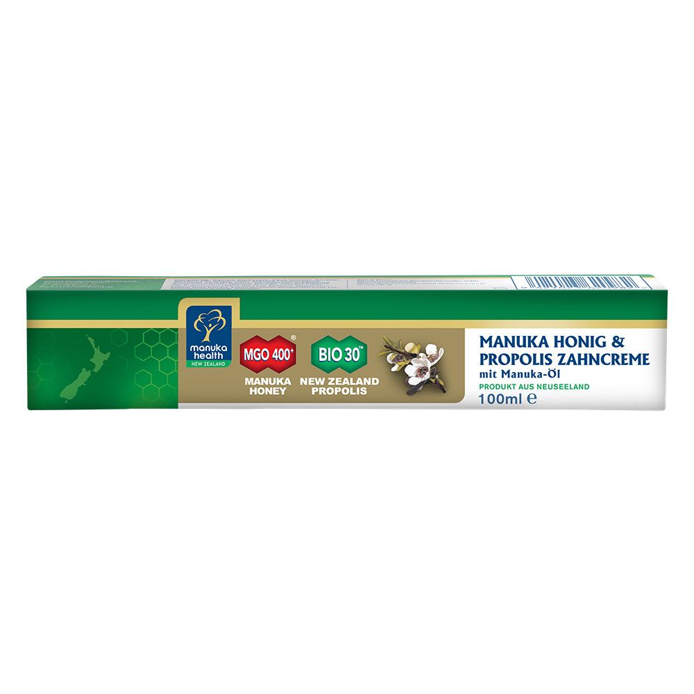 Zahnpasta-Verpackung. Grün, weiß und goldfarben. Text: MANUKA HONIG & PROPOLIS ZAHNCREME. Marke: MANUKA HEALTH.