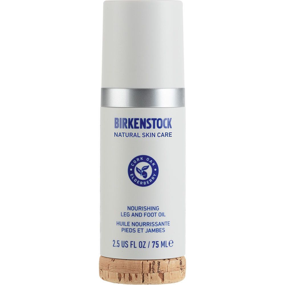 Zylinderförmige Flasche mit weißem Deckel und silbernem Ring. Aufschrift: Birkenstock, Natural Skin Care, Nourishing Leg and Foot Oil.