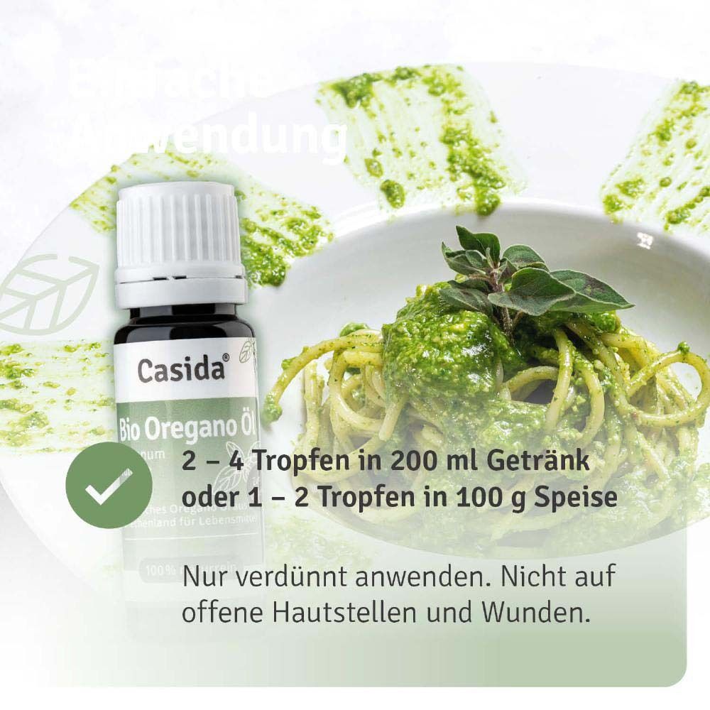Produktflasche neben einem Teller mit Pasta. Text: 2-4 Tropfen in 200 ml Getränk oder 1-2 Tropfen in 100 g Speise.