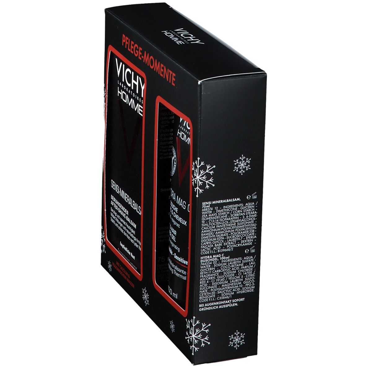 Schwarze Geschenkbox, seitliche Ansicht. Vichy Homme Logo und Produktnamen. Schneeflocken-Dekoration. Text in Deutsch. Zwei Produkte sichtbar.