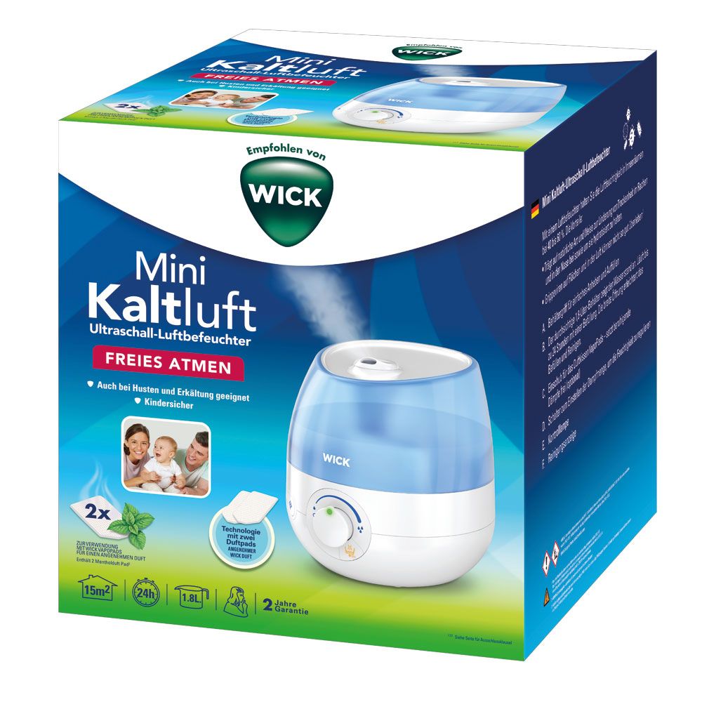 WICK Mini Kaltluft Ultraschall-Luftbefeuchter in Verpackung. Blau-weißer Luftbefeuchter, grüne Blätter, Familie, Text.
