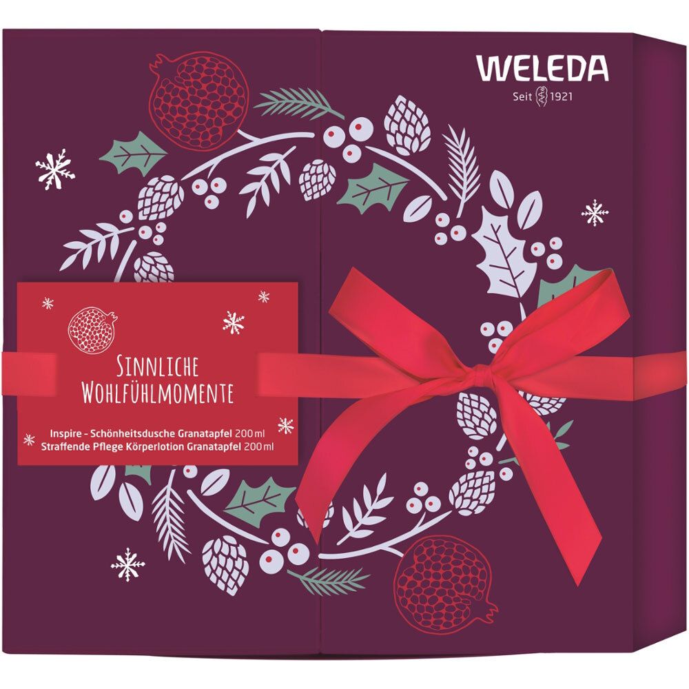 Geschenkset mit roter Schleife. Aufschrift: Sinnliche Wohlfühlmomente. Dekoration mit Granatapfel-Motiven und Weleda-Logo.