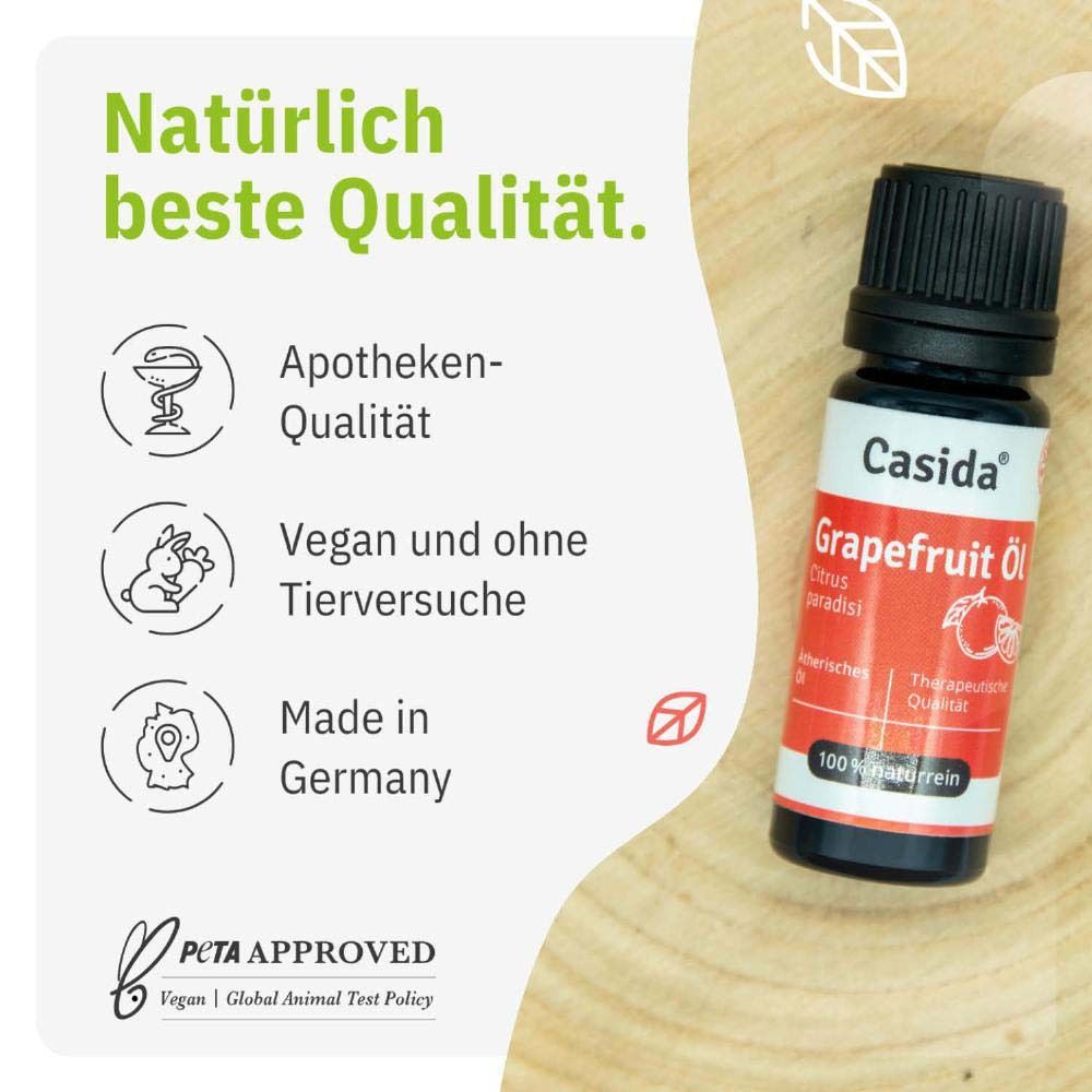Flasche Casida® Grapefruit Öl neben Text. Apotheken-Qualität, vegan und ohne Tierversuche, Made in Germany, PCTA APPROVED.