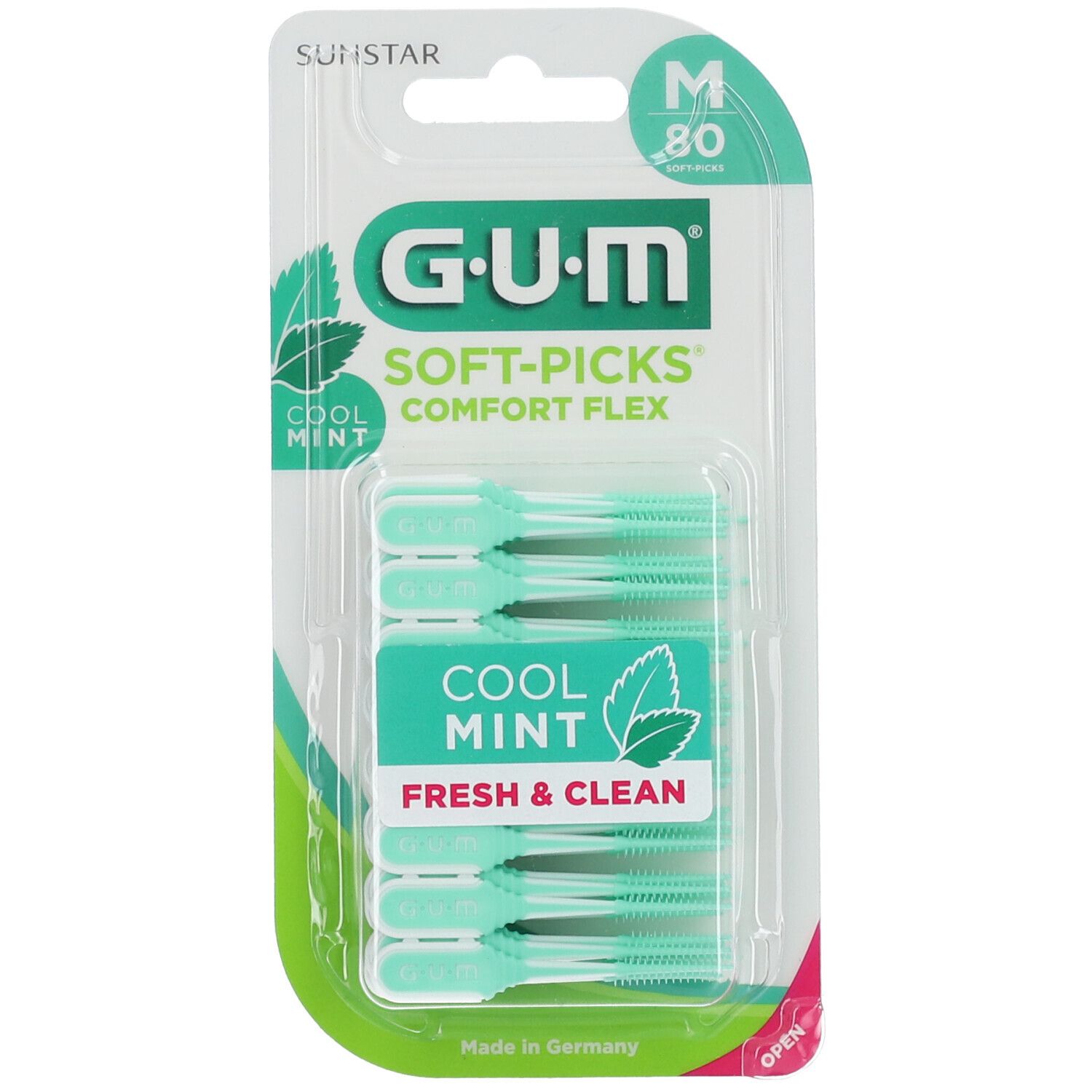 Blisterpackung mit grünen GUM Soft-Picks Comfort Flex. Mintfarbene Bürstenköpfe, grüne Verpackung mit Produktnamen und Logo.