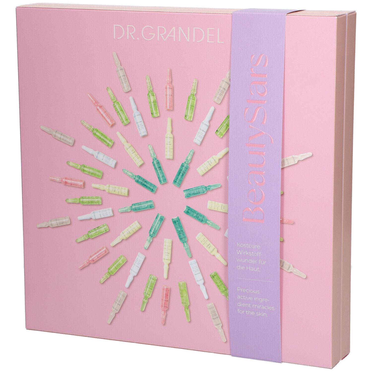 Rosa Geschenkbox mit Ampullen. Aufschrift DR. GRANDEL und BeautyStars. Lila Band mit Text. Ampullen in verschiedenen Farben angeordnet.