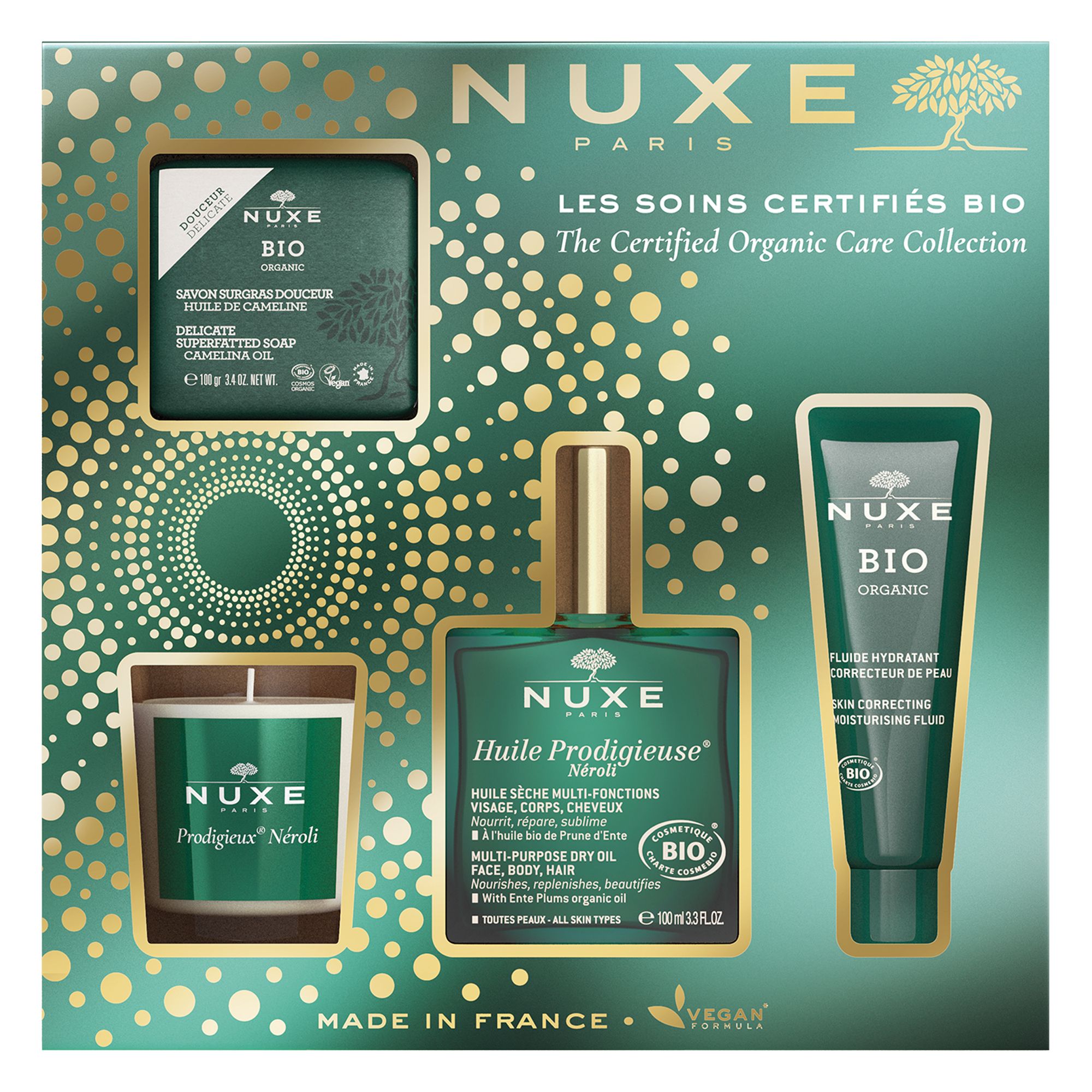 Geschenkset mit NUXE Bio-Produkten. Enthält Seife, Öl, Creme und Kerze. Grüne Verpackung mit goldenen Akzenten.