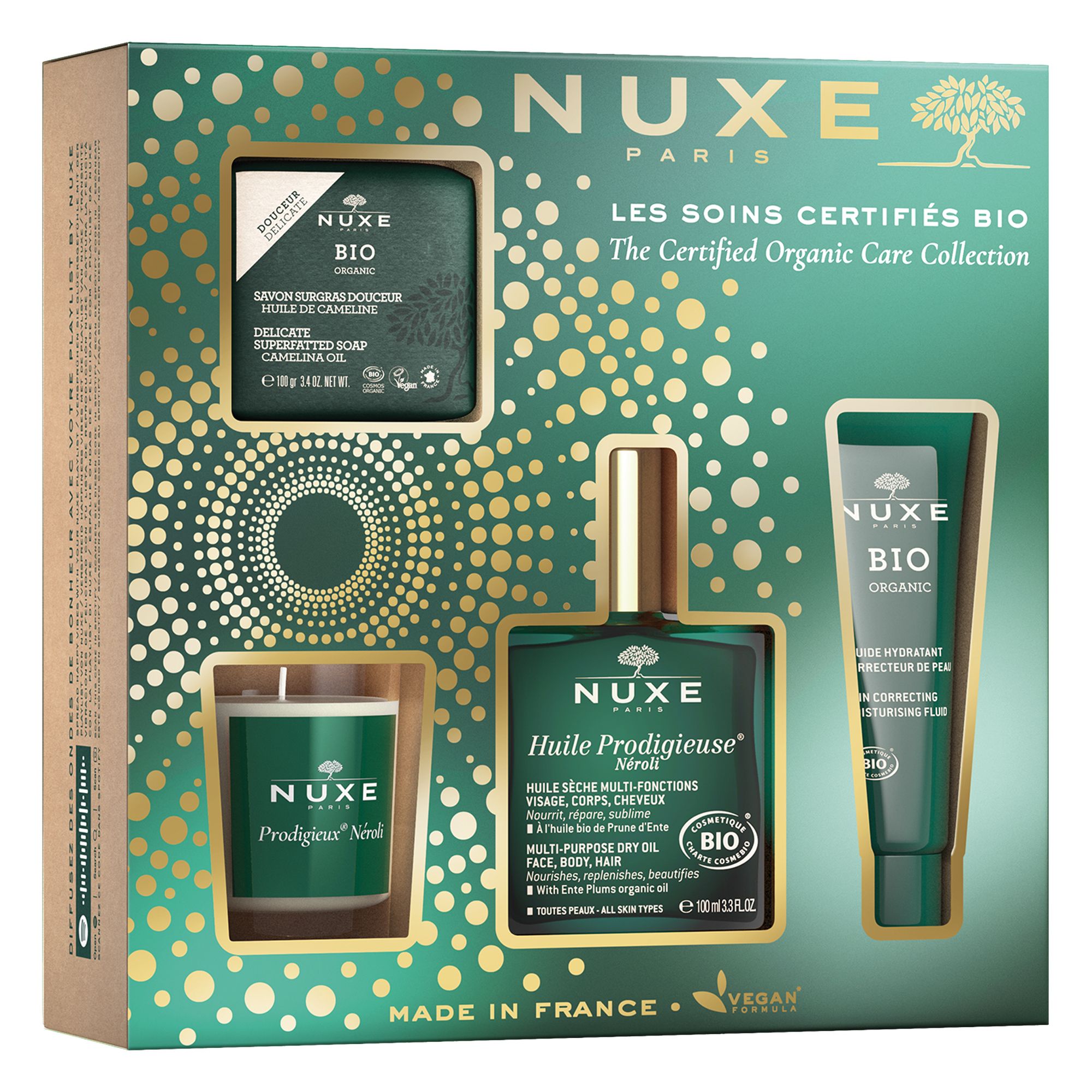 Geschenkset mit NUXE Bio-Produkten. Enthält Seife, Öl, Creme und Kerze. Verpackung mit goldenen Akzenten.