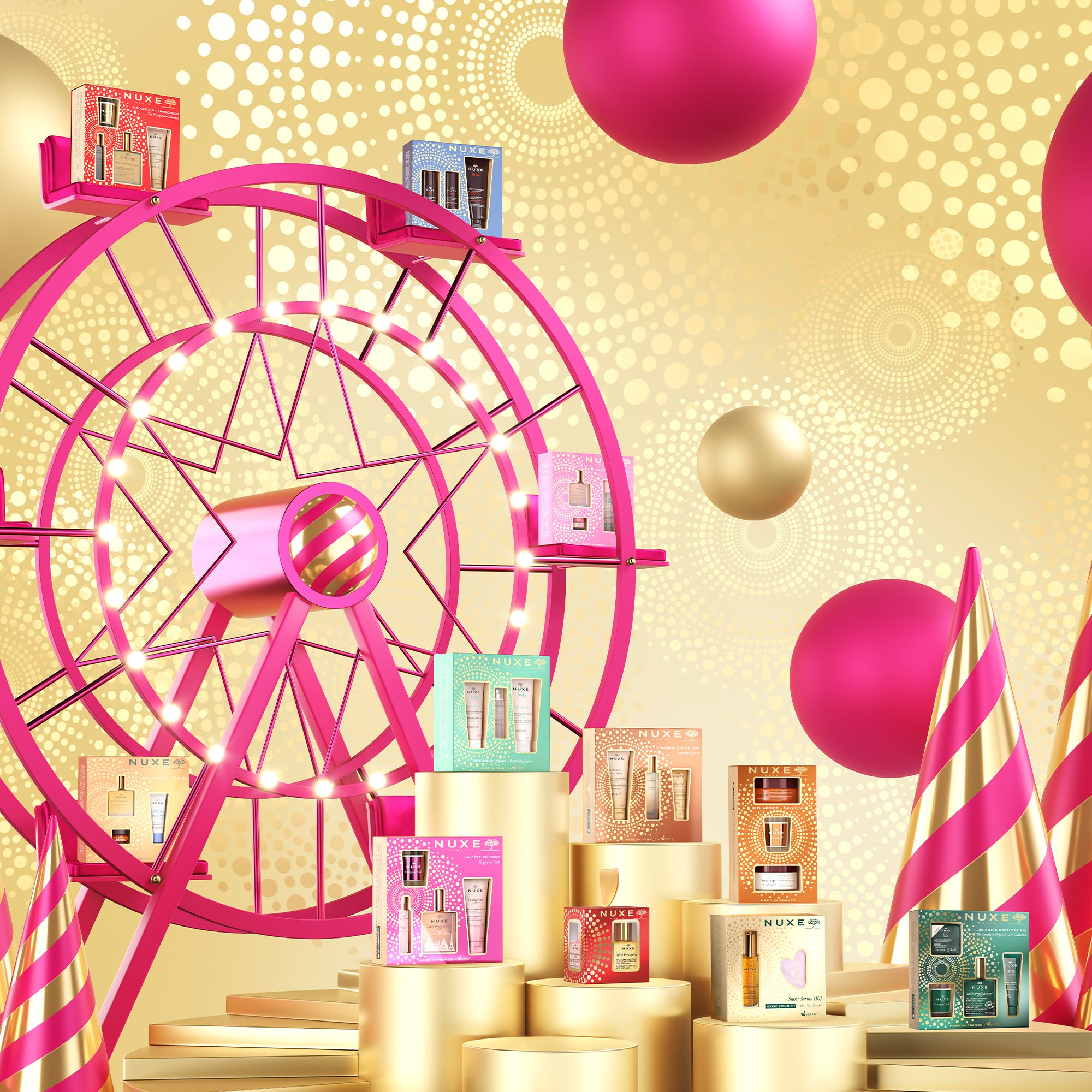 Mehrere Geschenksets mit NUXE Bio-Produkten auf goldenen Podesten. Jahrmarkt mit Riesenrad im Hintergrund.