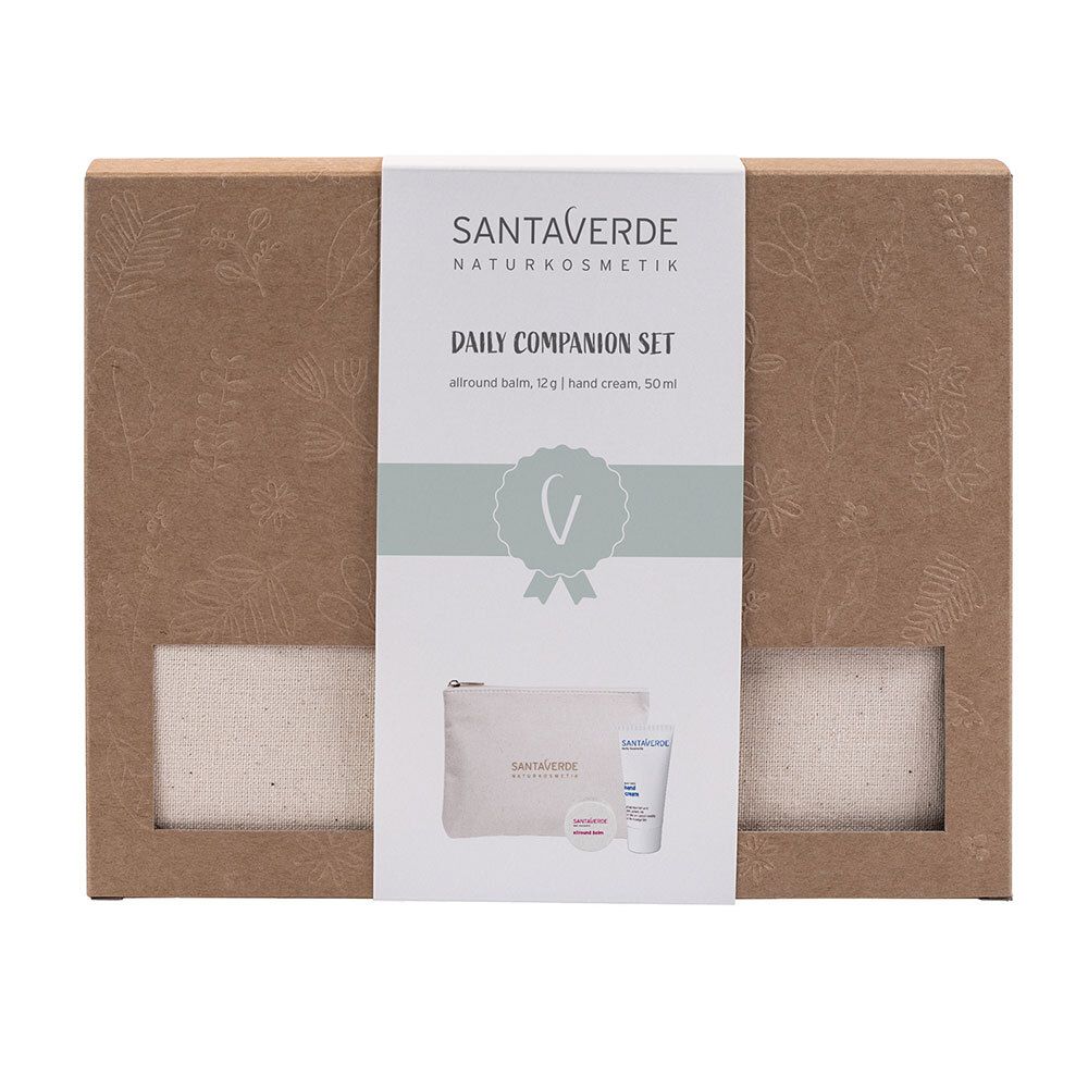 Geschenkset mit Kosmetikprodukten. Enthält eine Tasche, eine Creme und einen Balsam. Verpackt in einem braunen Karton mit Sichtfenstern.