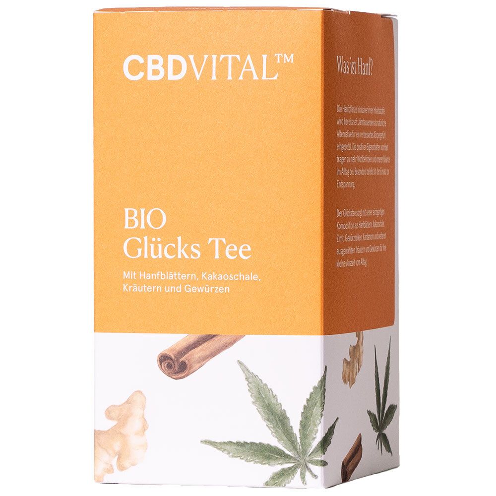 CBD VITAL BIO Glücks Tee-Verpackung. Orange-weiß. Text: CBDVITAL, BIO Glücks Tee, Hanfblätter, Kakao, Kräuter, Gewürze.
