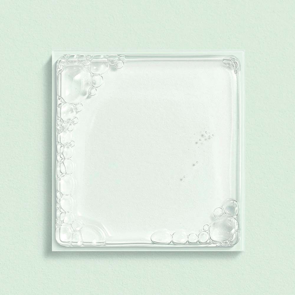 Quadratische Glasplatte mit Seifenblasen-Dekoration an den Rändern.