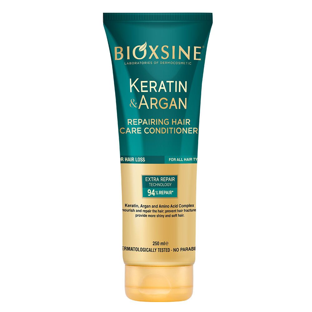Haarspülung in Tube. Grün-goldene Verpackung. Aufschrift: BIOXSINE Keratin & Argan. Reparierende Haarpflege. Für alle Haartypen.