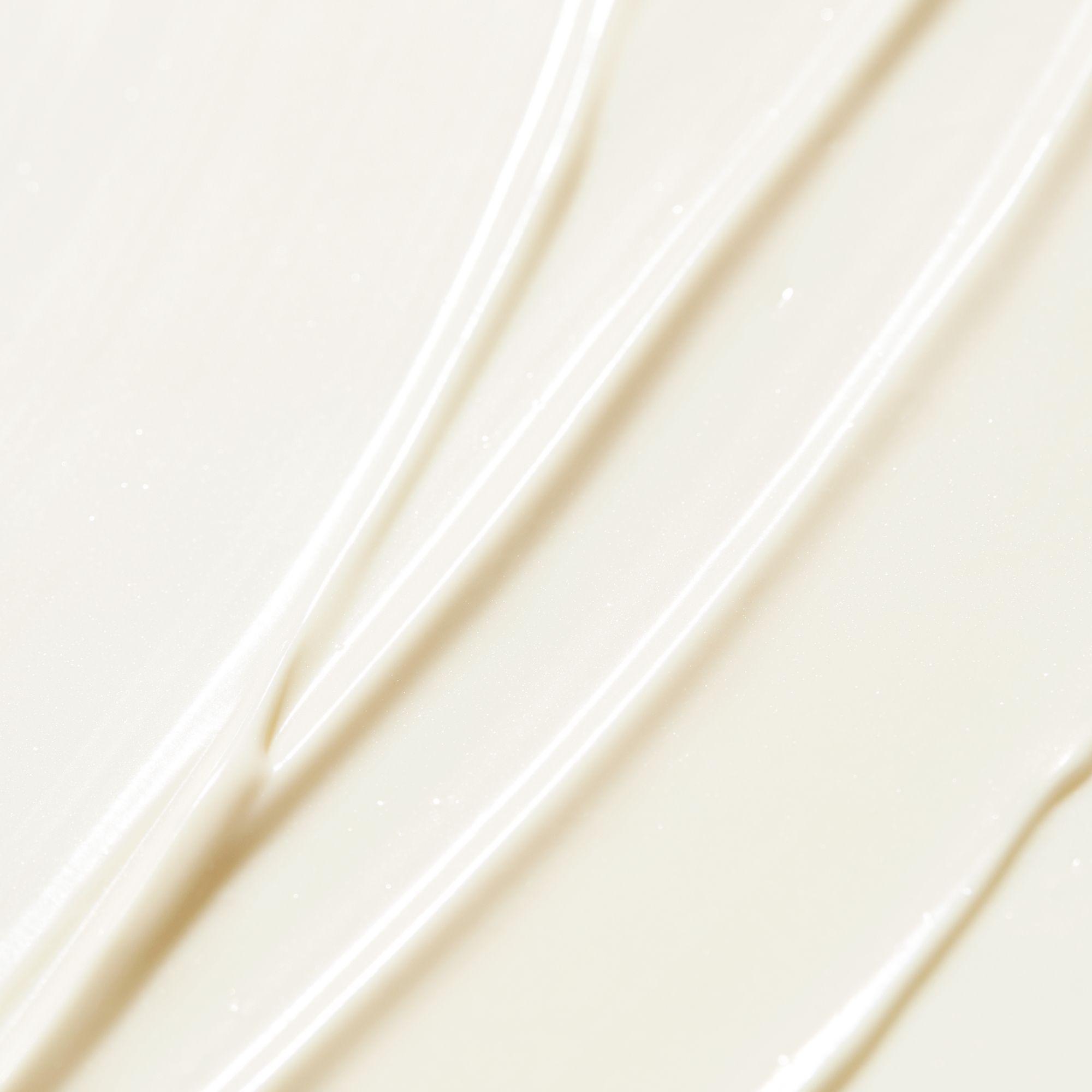 Nahaufnahme von weißer Sonnencreme-Textur. Streifenmuster.