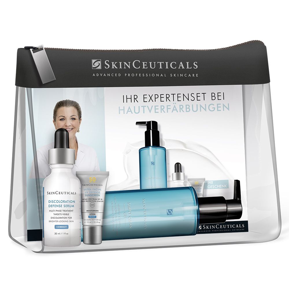 Set mit Produkten zur Behandlung von Hautverfärbungen in einer transparenten Kosmetiktasche. Enthält Serum, Creme und Reinigung.