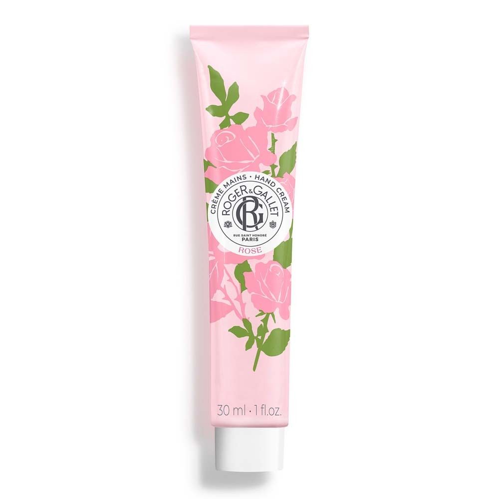 Rosa Handcreme-Tube. Rosa Hintergrund, Rosen- und Blätter-Dekor. Logo und Text: ROGER&GALLET, Rose, Crème Mains Hand Cream. Weiße Tube-Öffnung.