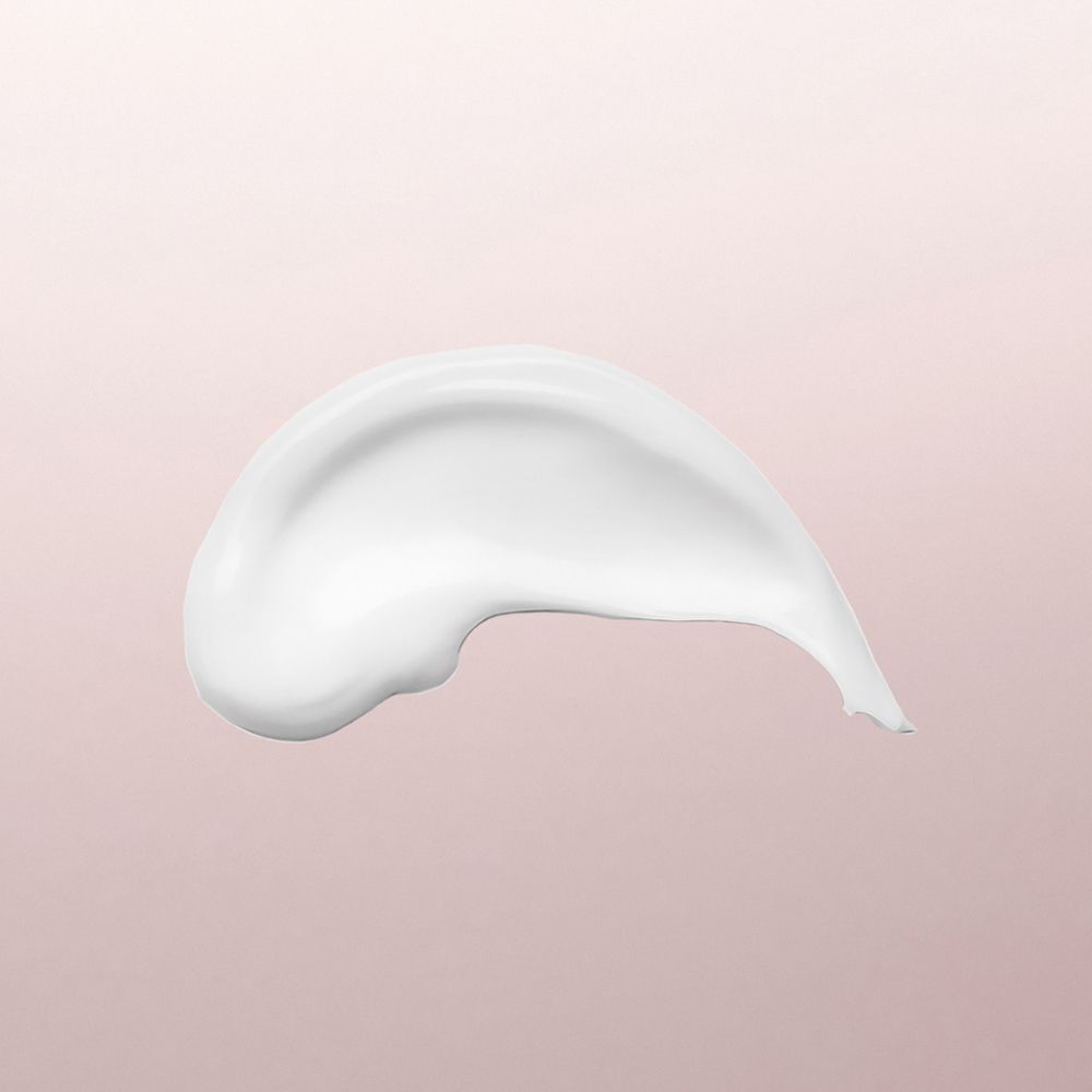Eine Spur von Louis Widmer hydraderm Tagesemulsion auf rosa Hintergrund.
