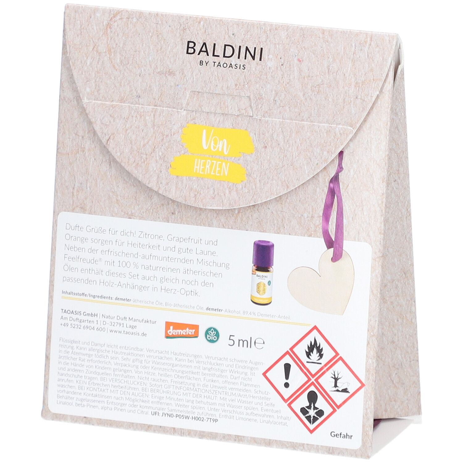 Rückseite des BALDINI Mini-Duftsets „Von Herzen“. Text, Flakon, Holzherz-Anhänger. Warnhinweise und Demeter-Siegel.