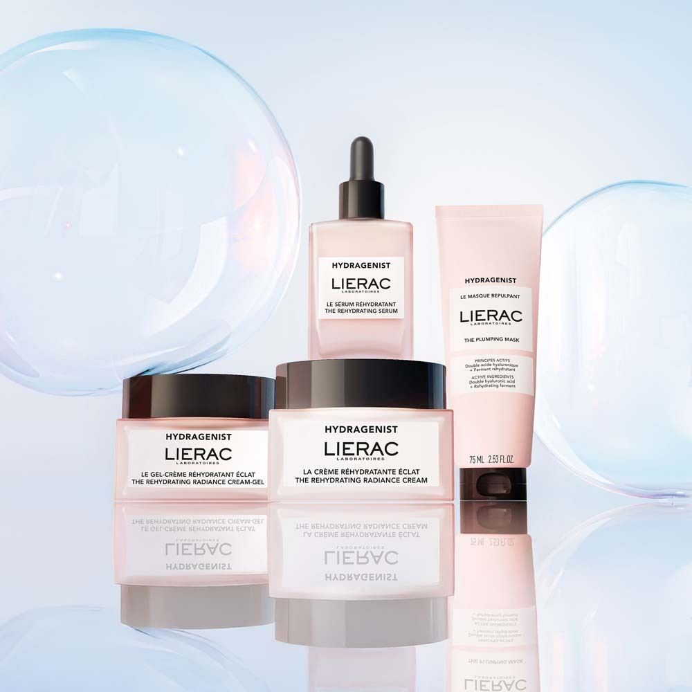 Verschiedene LIERAC-Produkte. Rosa Flaschen und Tiegel. Aufschrift "Hydragenist".