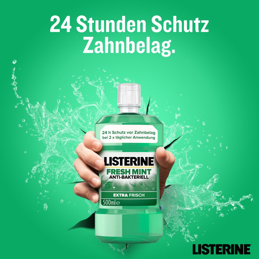 Hand durchbricht Wand. LISTERINE® Fresh Mint Flasche. Text: 24 Stunden Schutz Zahnbelag.