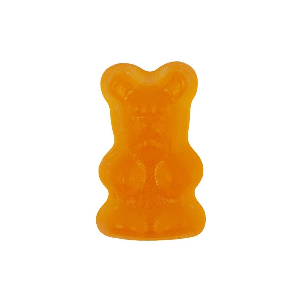 Ein einzelnes orangefarbenes Multivitamin Bärchen.