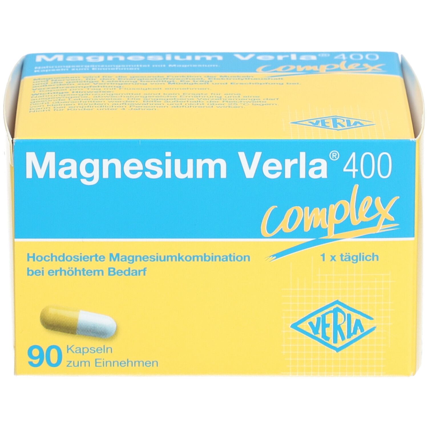 Gelb-blaue Schachtel mit "Magnesium Verla 400 complex". 90 Kapseln. Eine Kapsel ist sichtbar.