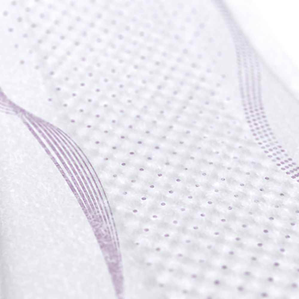 Nahaufnahme der Oberfläche eines Inkontinenzeinlage. Kleine Punkte und wellenförmige Linien.