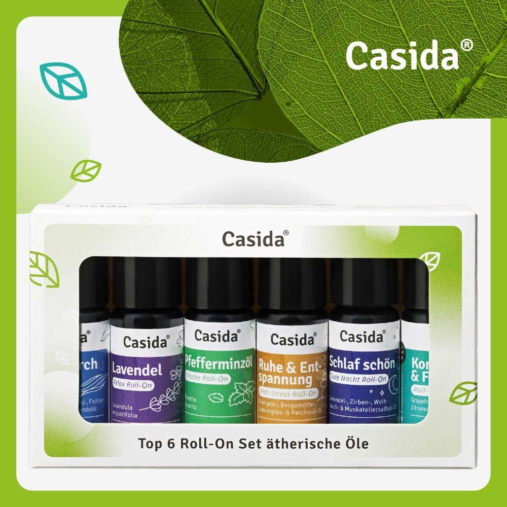 Eine weiße Schachtel mit sechs Roll-On-Flaschen. Auf der Schachtel steht Casida®. Die Flaschen sind in verschiedenen Farben gehalten.
