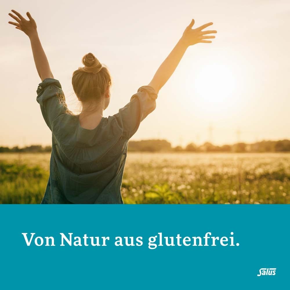 Frau im Feld, Arme oben. Text: Von Natur aus glutenfrei. Salus Logo.