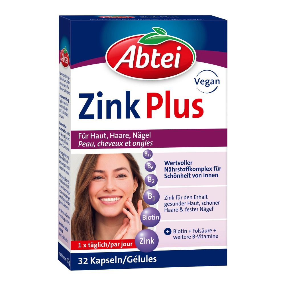 Abtei Zink Plus Packung. Enthält 32 Kapseln. Vegan. Für Haut, Haare, Nägel. Mit B-Vitaminen. Frau berührt ihr Gesicht.